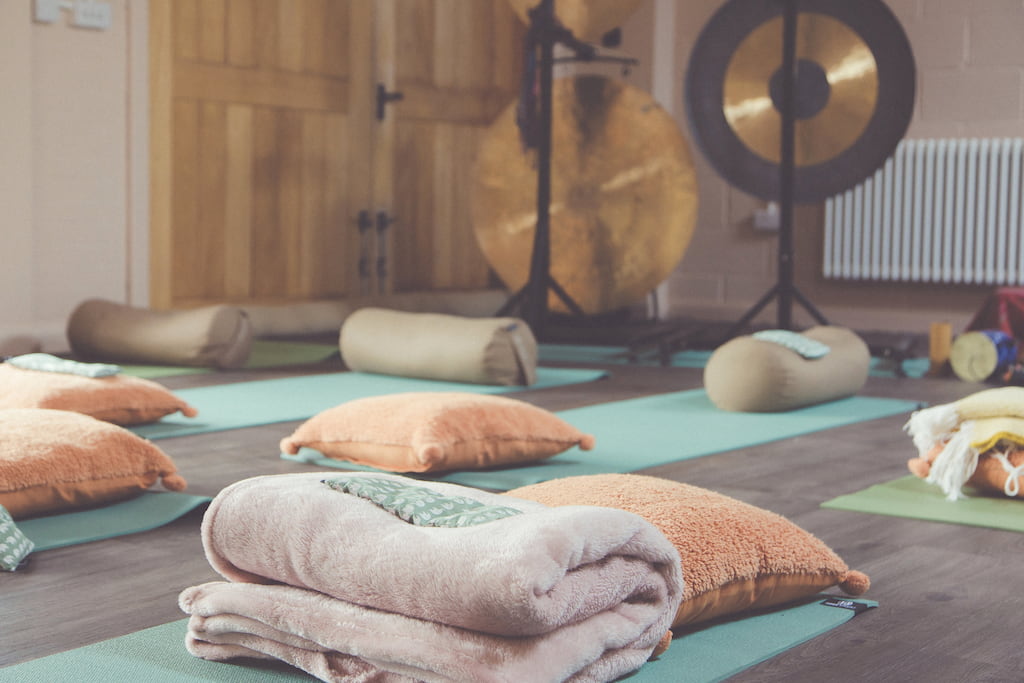 towels and mats in a cozy yoga studio